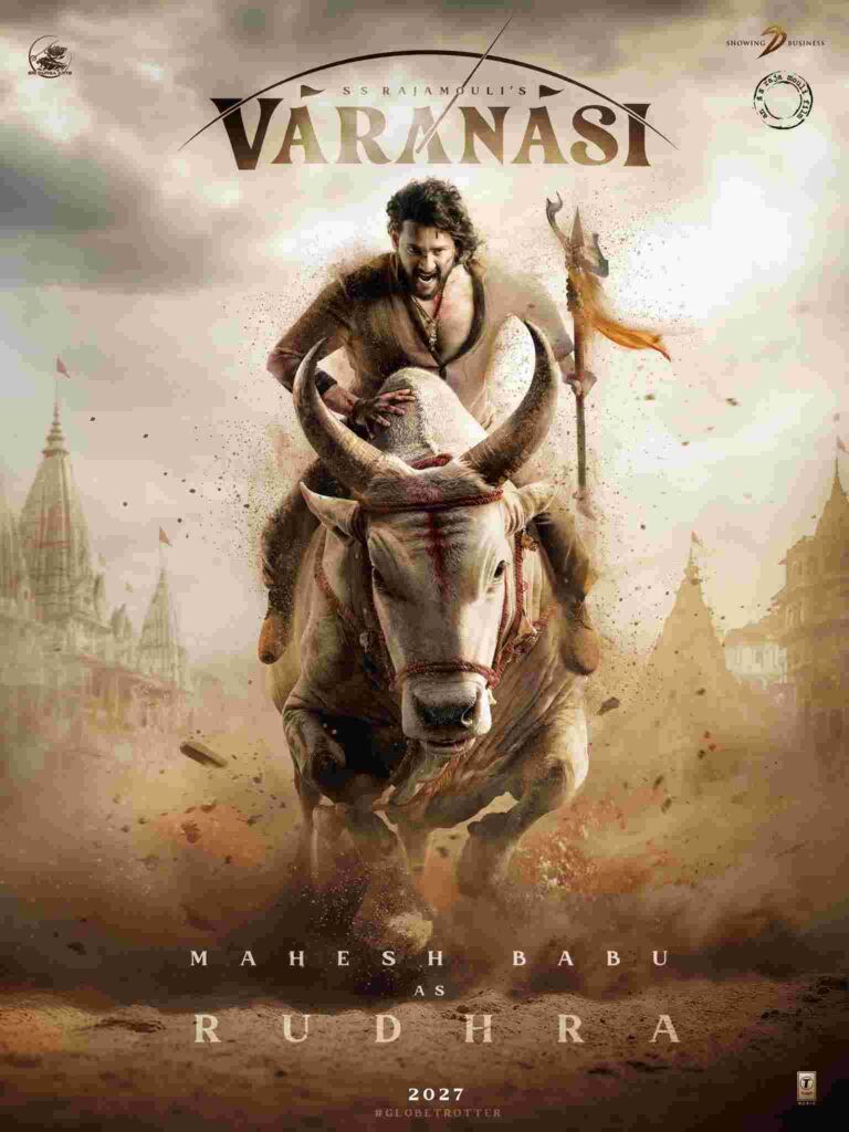 SS Rajamouli is celebrated for creating larger-than-life cinematic moments, and he didn’t disappoint at the Globetrotter event. Fans got a taste of the drama when the lead actor rode a mechanical bull on stage, echoing his teaser introduction as Rudhra in Varanasi. The first look of Mahesh Babu as Rudhra showed him atop an ox, wielding a trishul.
